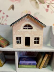 A close-up shot of the exterior of the 12th scale miniature dollhouse